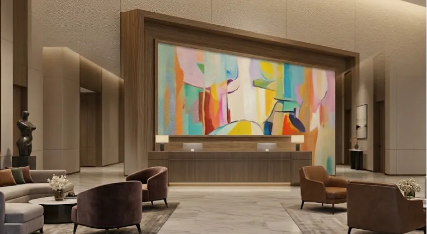 Hotel lobby with abstract digital art display.